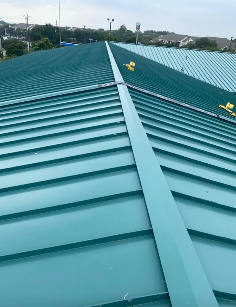 Green commercial metal roof ridge and valley for Metal Roof Repair in Brunswick